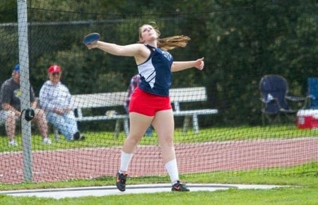 Courtney Rhoda throwing the discus.